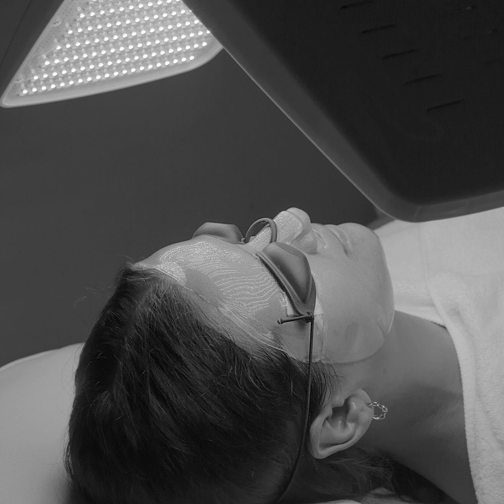 Black and white thumbnail depicting LED Light Therapy, a modern skin treatment method.