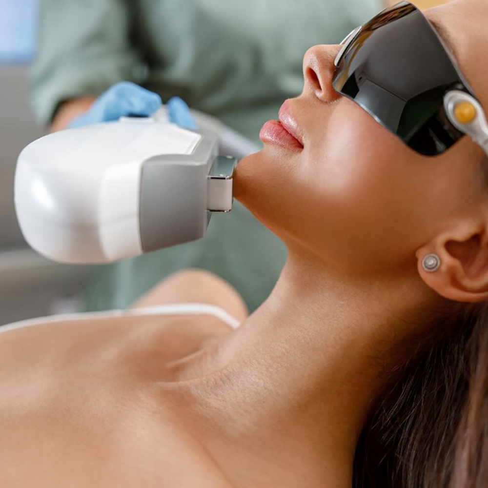 Peaceful female patient undergoing Photo Rejuvenation Facial (IPL+RF) treatment, highlighting advanced technology and collagen stimulation.